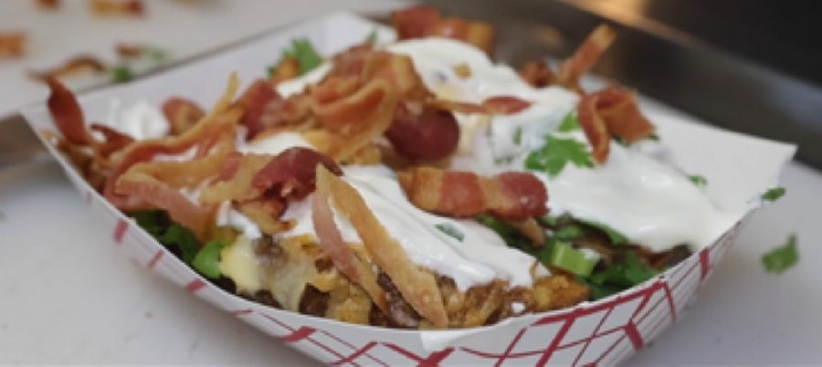Loaded baked potato topped with cottage pie filling and melted cheese